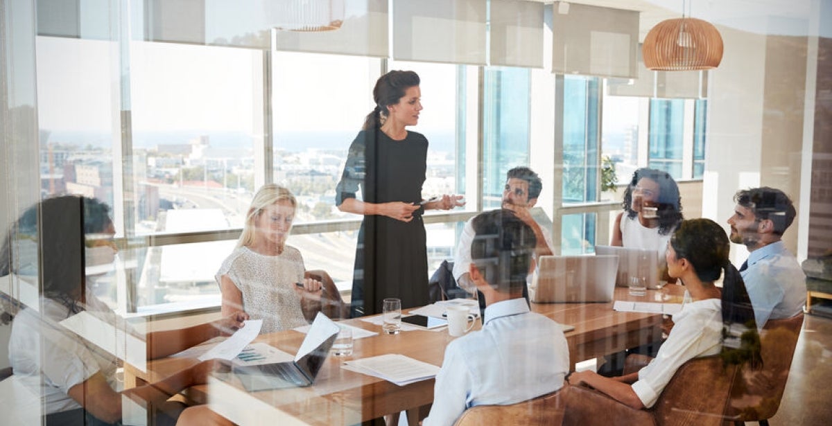 HR Manager leads a team meeting