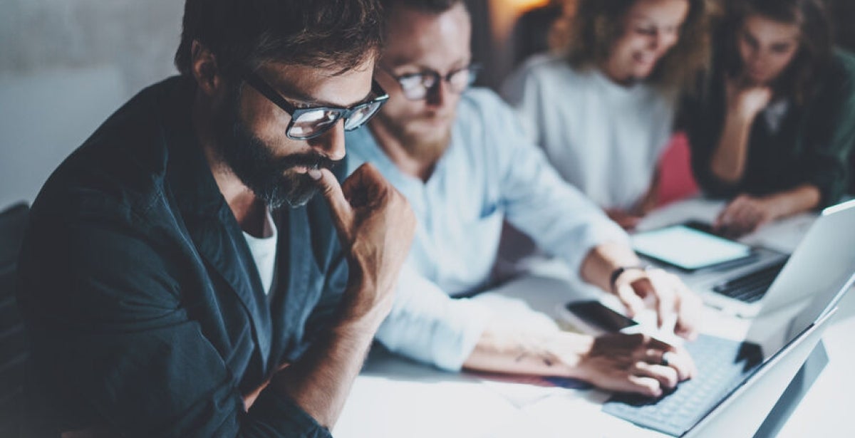 Cyber security experts in a meeting discussing the risks of cloud computing