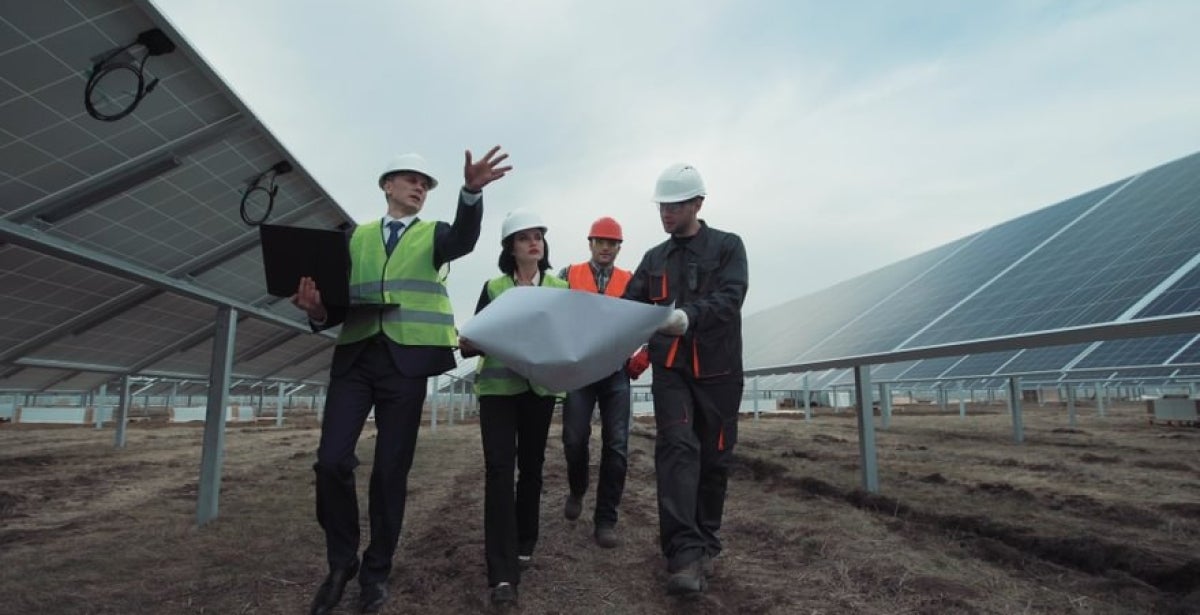 Four project managers discussing plans