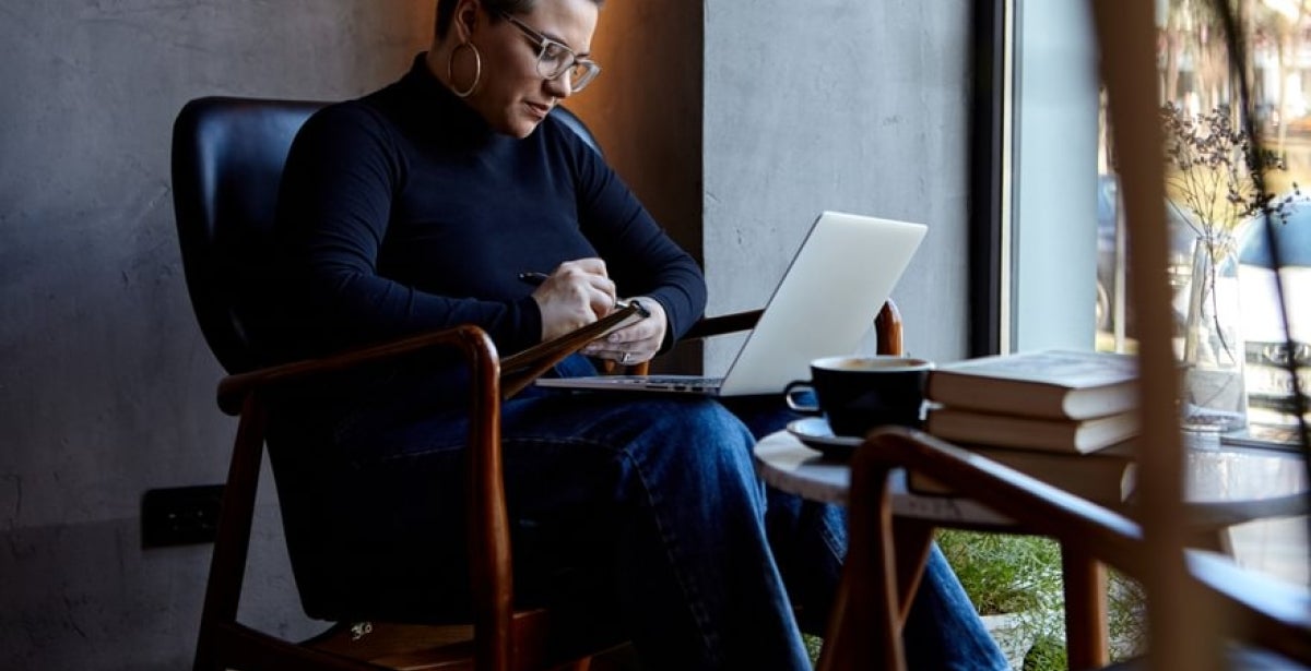 Psychology student studying on his laptop