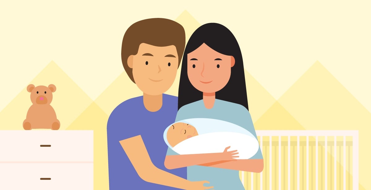 A mother and father hold a newborn baby.