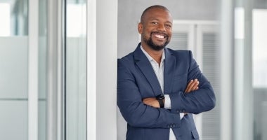 Business executive smiling at workplace