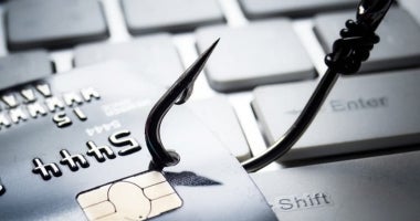 A hook phishing a credit card